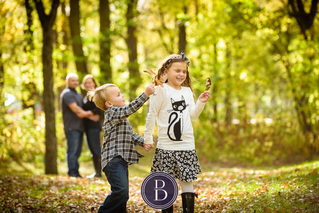 family fun in leaves boy and girl photo