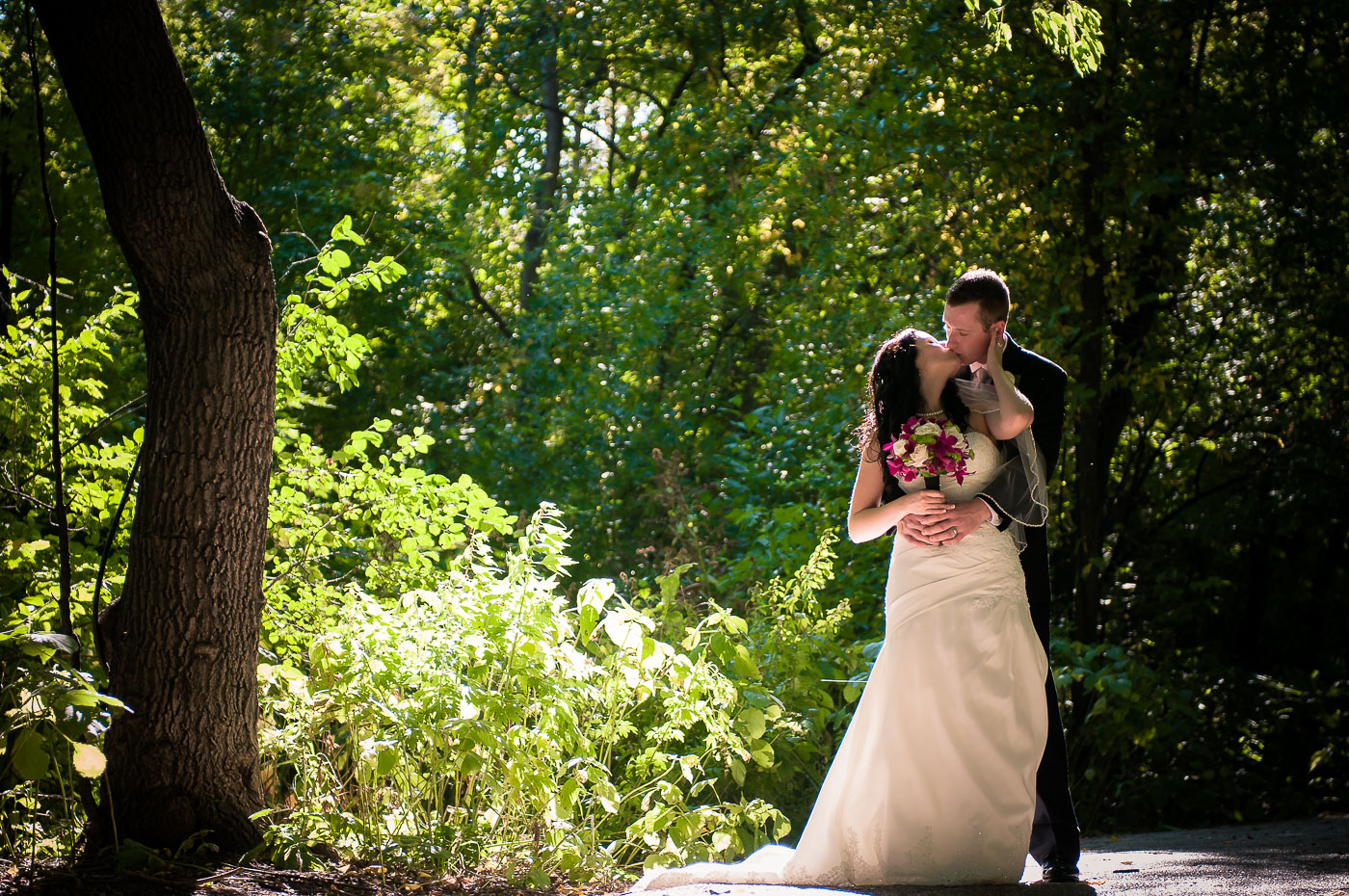 bride groom kiss park photo