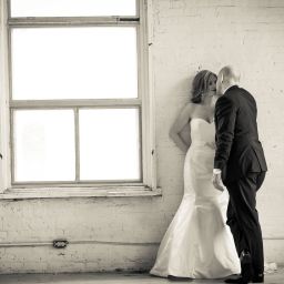 wedding couple kiss by window