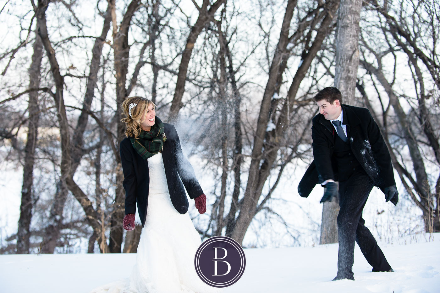 Winnipeg winter wedding snowball fight bride and groom