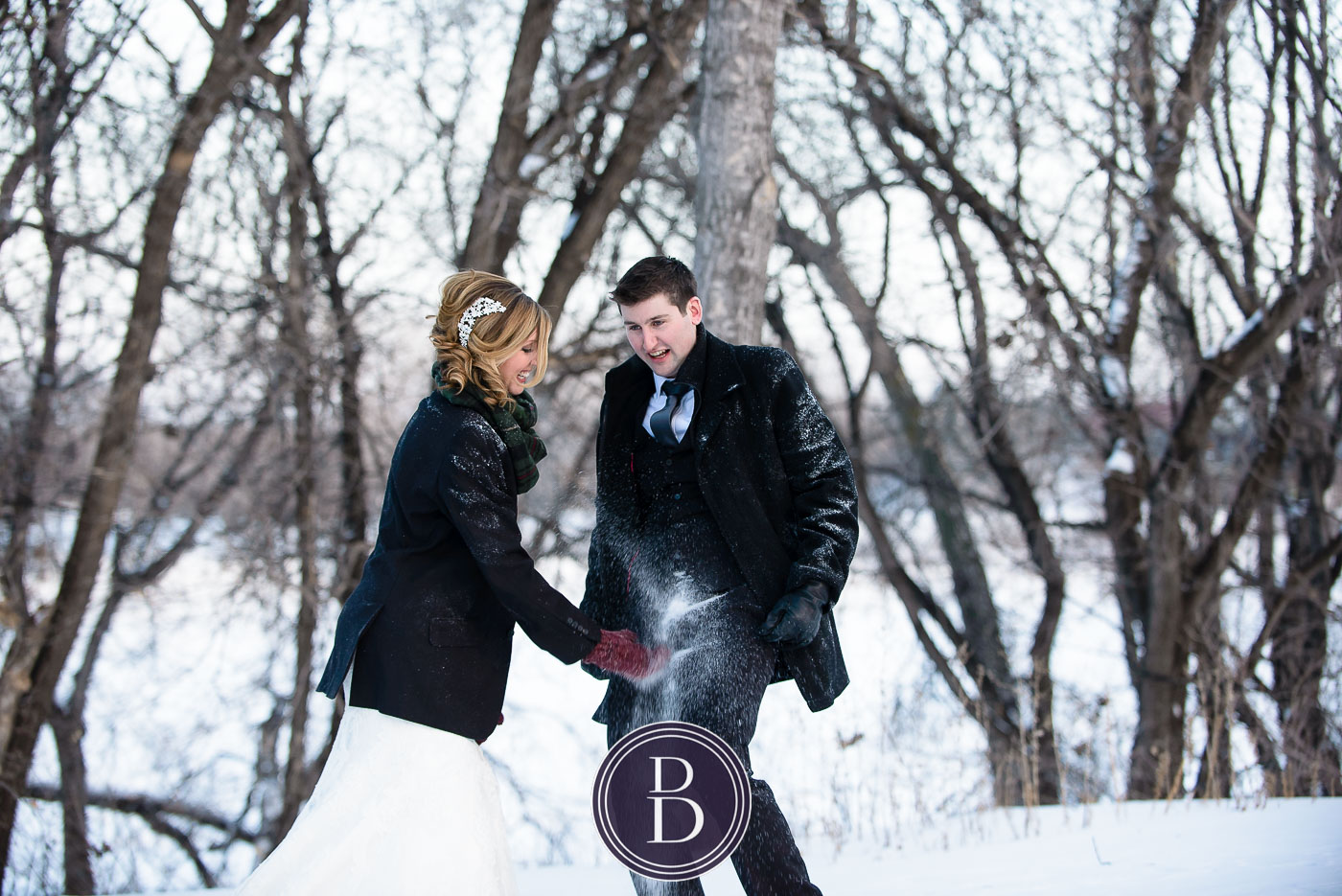 Winnipeg winter wedding snowball fight bride and groom