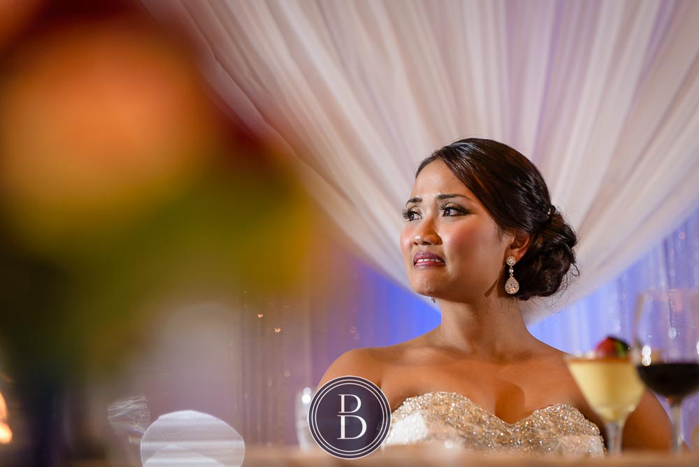 Winnipeg wedding photos bride emotional during speeches Victoria Inn Hotel reception