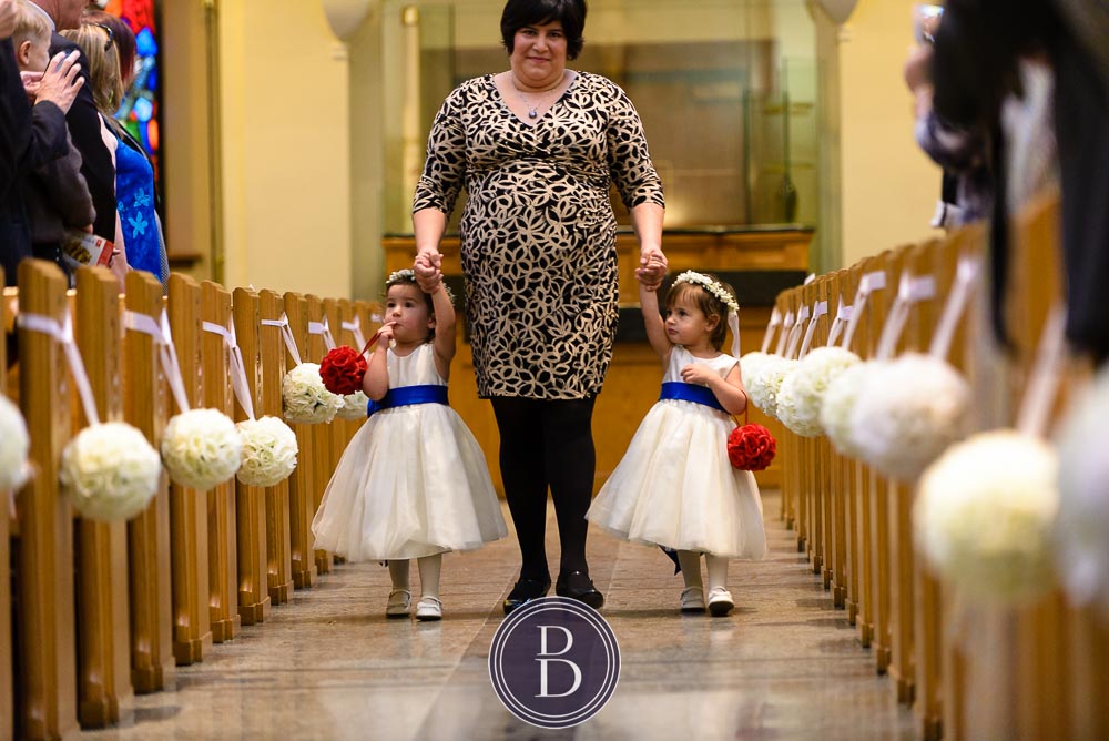 Winnipeg wedding photos St Mary's Cathedral two cute flower girls walking down the isle with mom