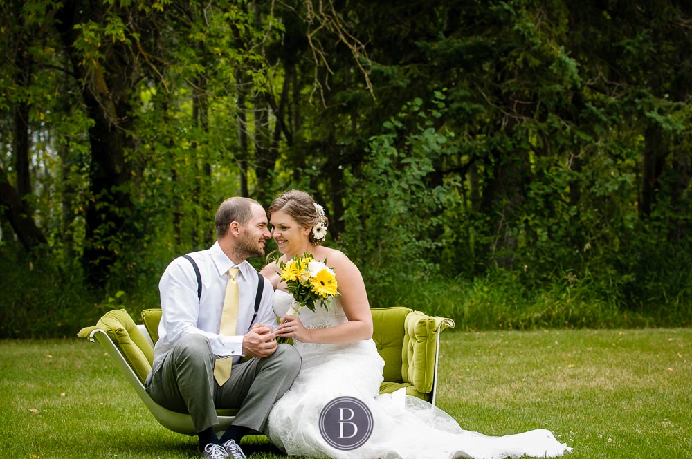 bride groom formal portrait sitting on green bath tub in love
