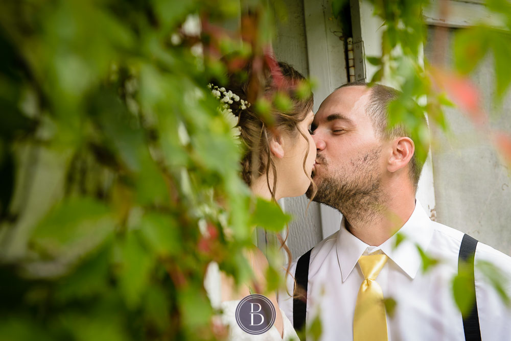 Bride groom formal portrait kiss