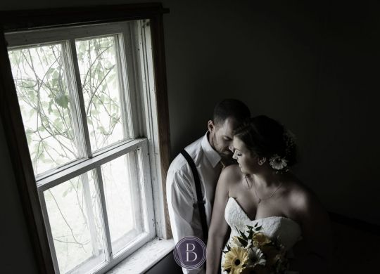 Wedding bride groom indoor window portrait
