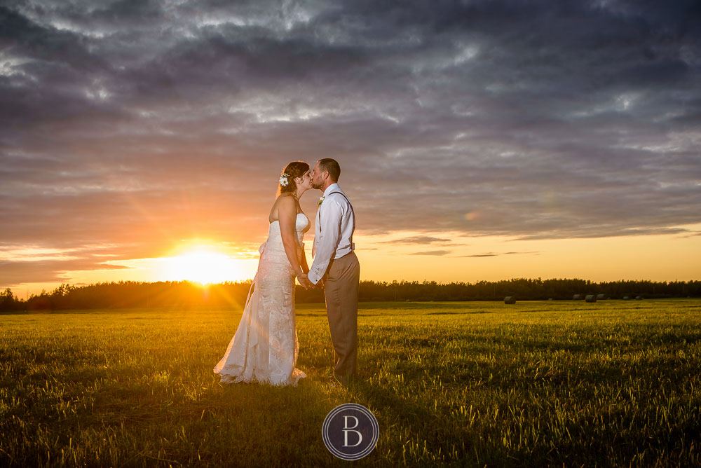 Wedding bride groom sunset portrait kiss
