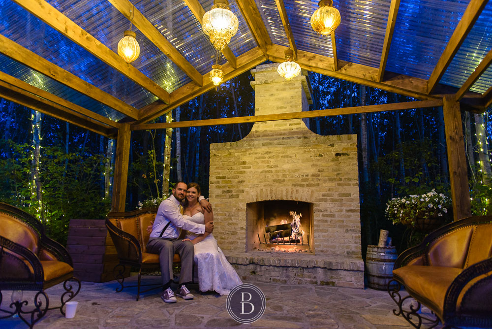 Bride and Groom evening by fireplace