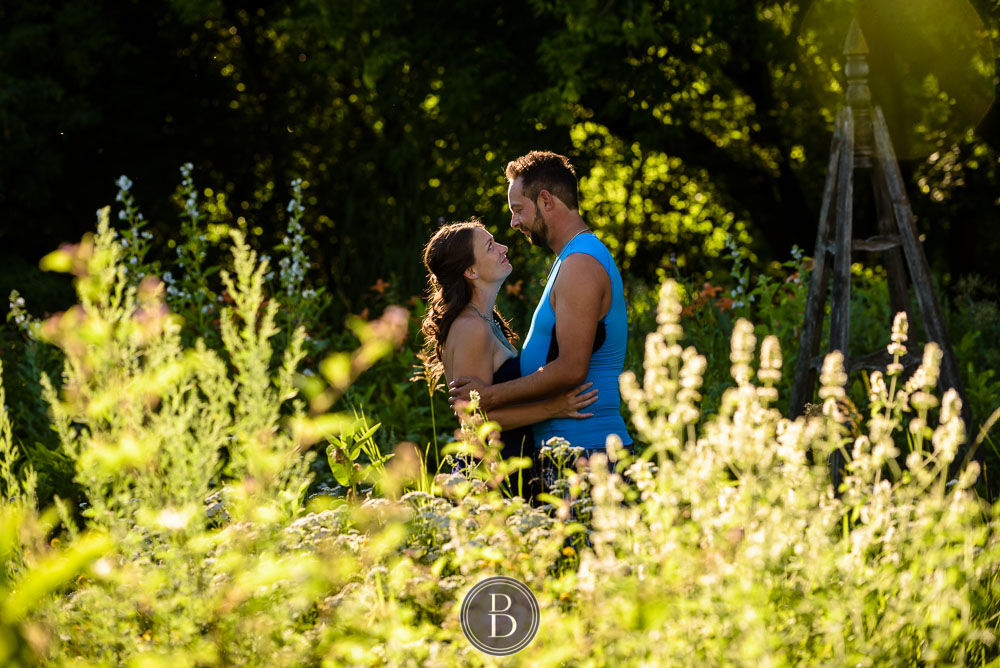 Couple standing in flower garden grounds