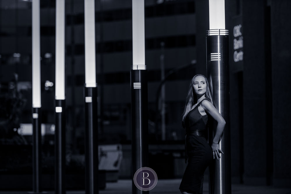 model in evening portrait by light posts Winnipeg