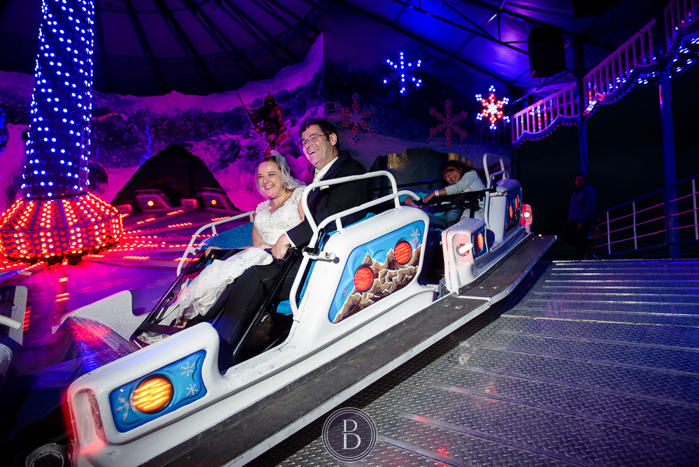 Winnipeg wedding images Red River Ex ride bride and groom laughing