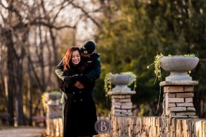 Photo of engaged girl hugging and smiling at fiancee Assiniboine park