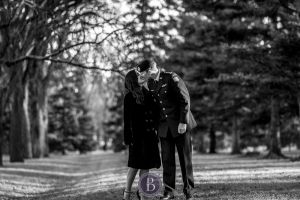Engaged Winnipeg couple kiss Assiniboine park at fall time