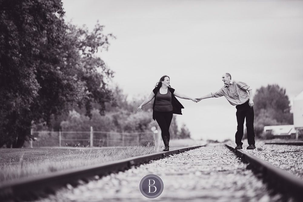 Fall engagement photography session engaged couple train tracks