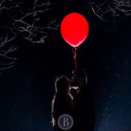 evening couple kiss and balloon