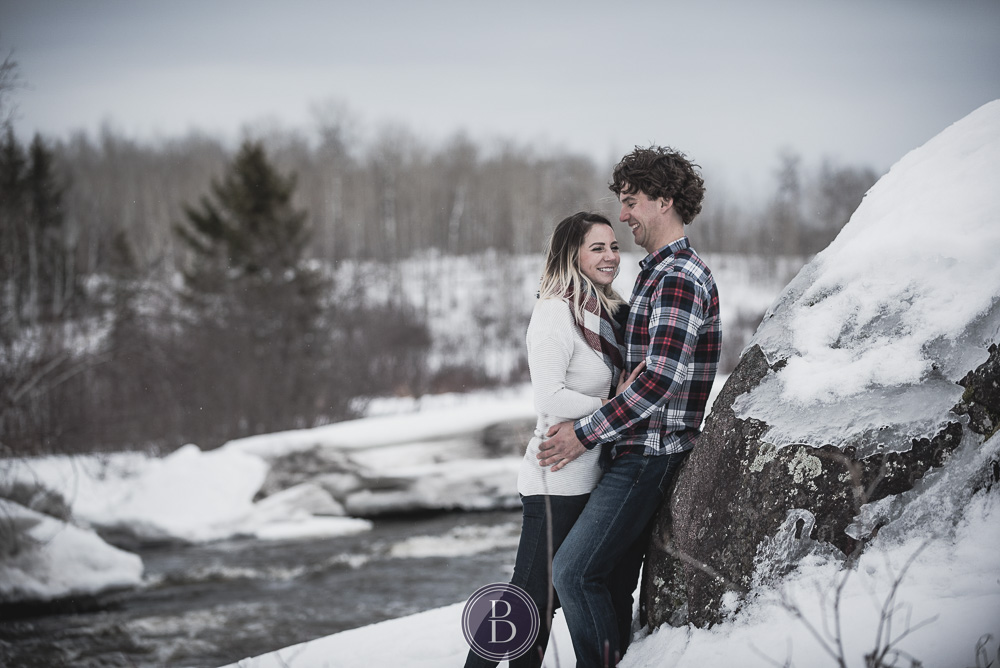 Winter engagement photos engaged couple smiles in love