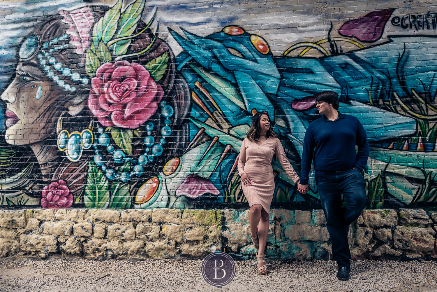 engaged couple by exchange district graffiti walls