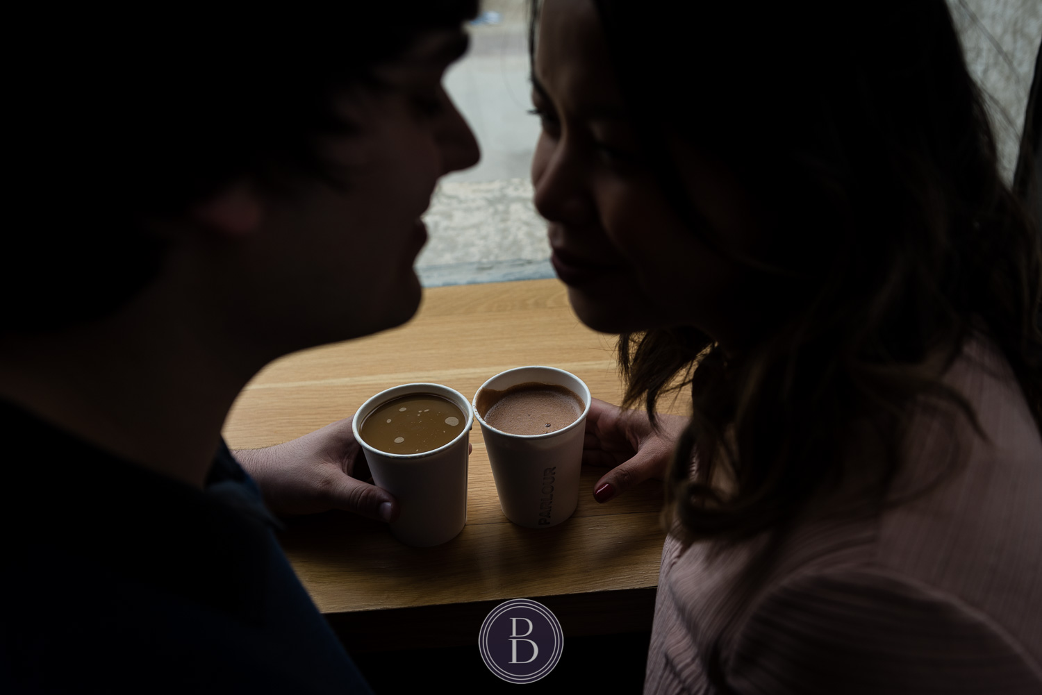 hot chocolate enjoyed by engaged couple