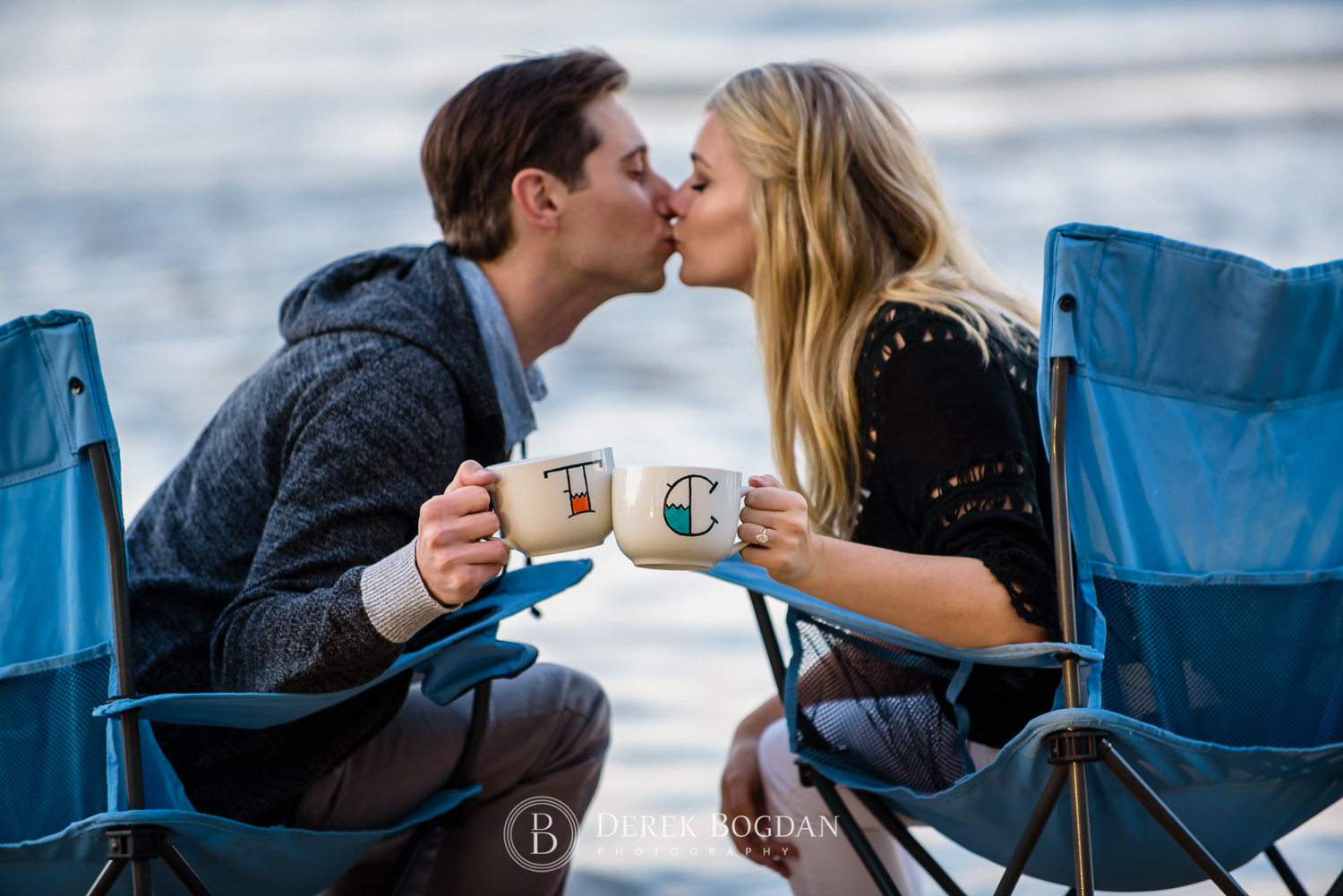 Gimli beach engagement photo session kiss coffee mugs engaged couple