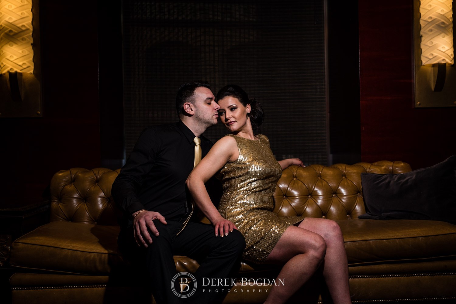 Downtown Winnipeg Engagement Photos at Hy's stake house couch