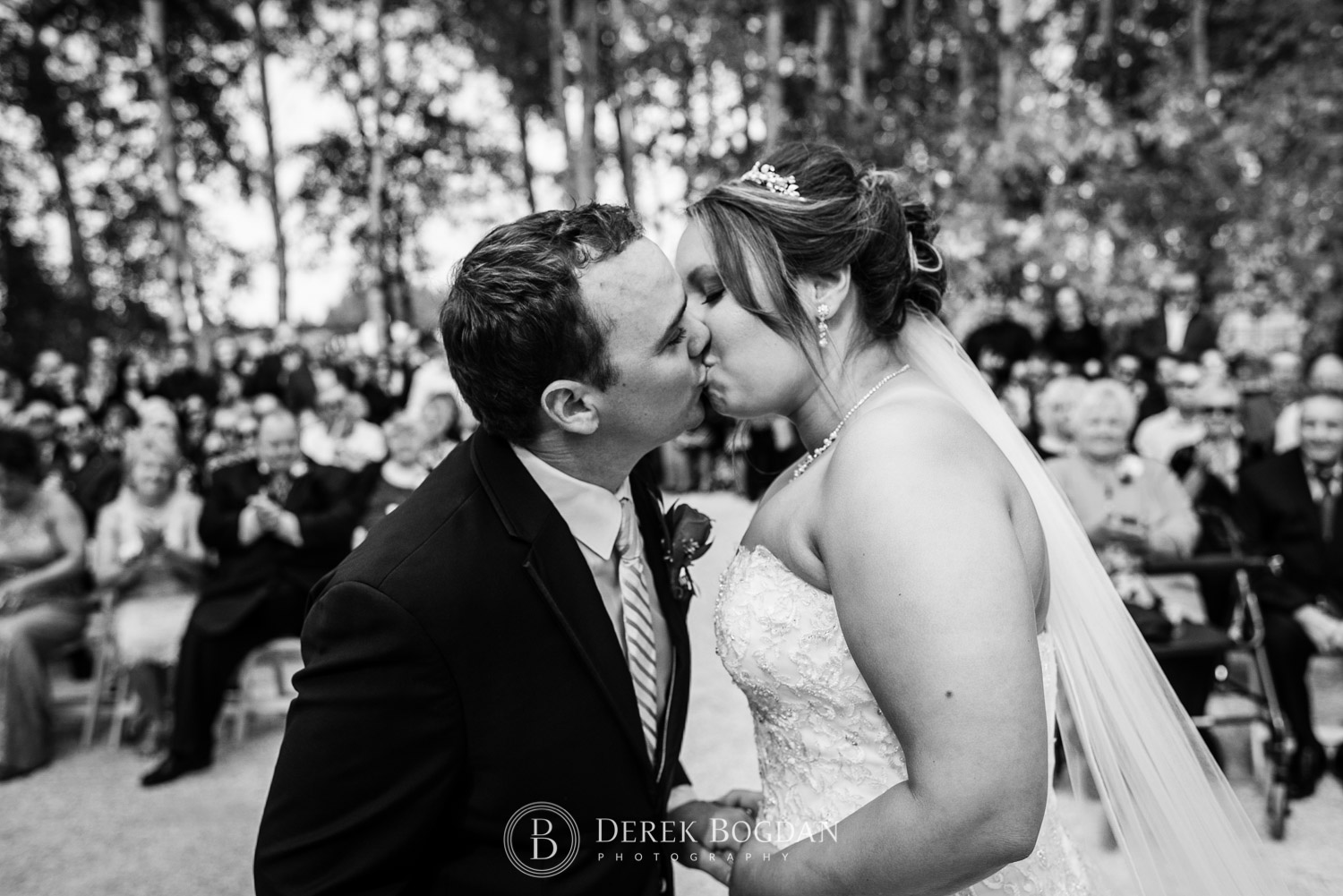bride and groom ceremony kiss