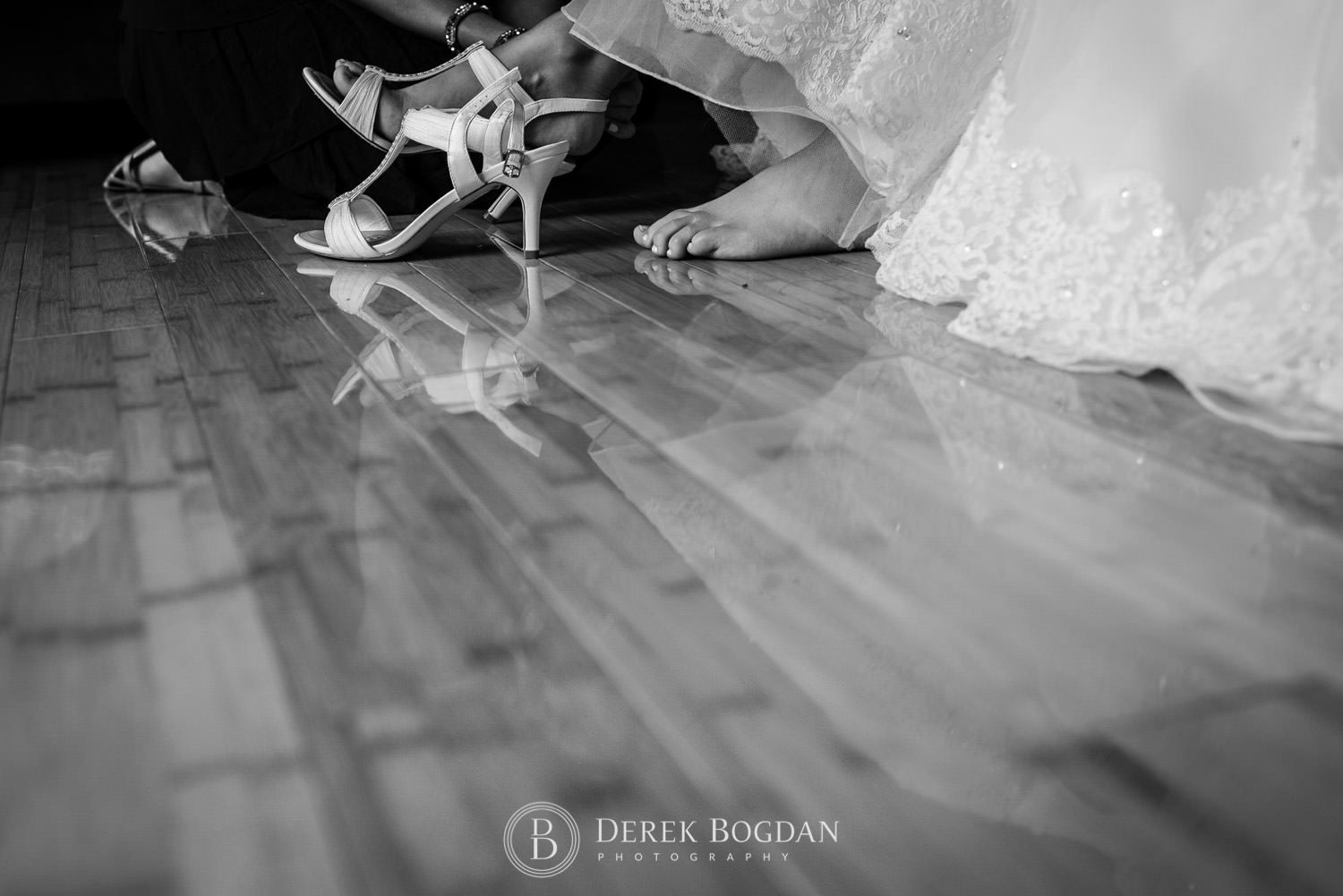 bride getting ready putting on shoes