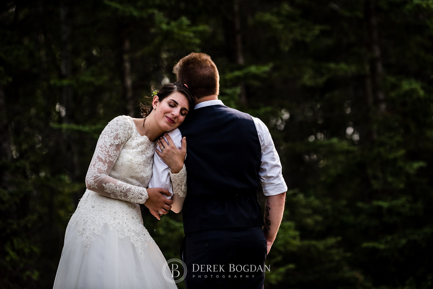 bride and groom holding each other in love outdoor ceremony Manitoba wedding