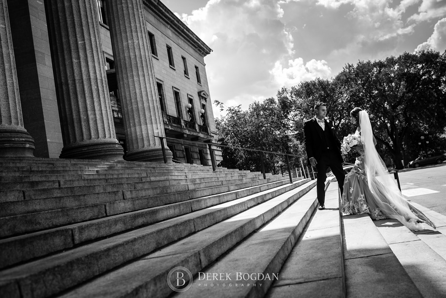 bride and groom on staircase Manitoba Legislative building