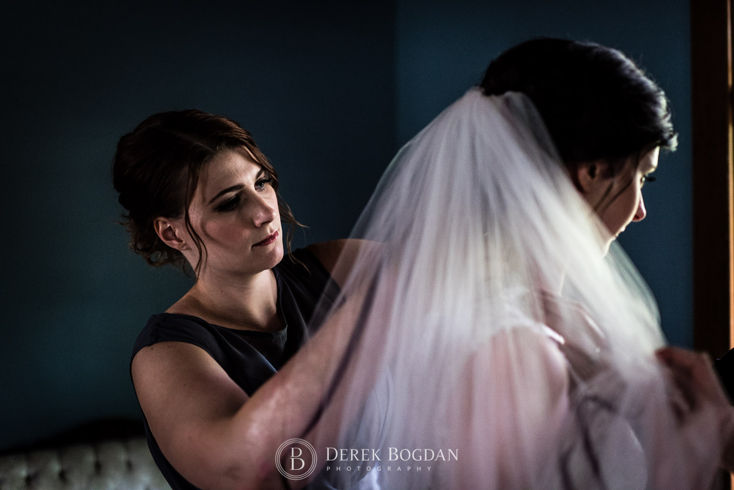 maid of honour helping out getting ready veil Evergreen Village Wedding Niverville Manitoba