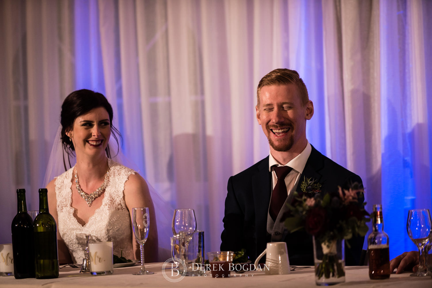 bride and groom smiles reception time
