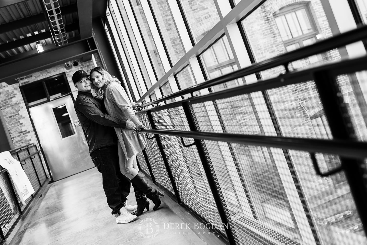 Engagement photos inside Red River college Monica and Tylor laughing