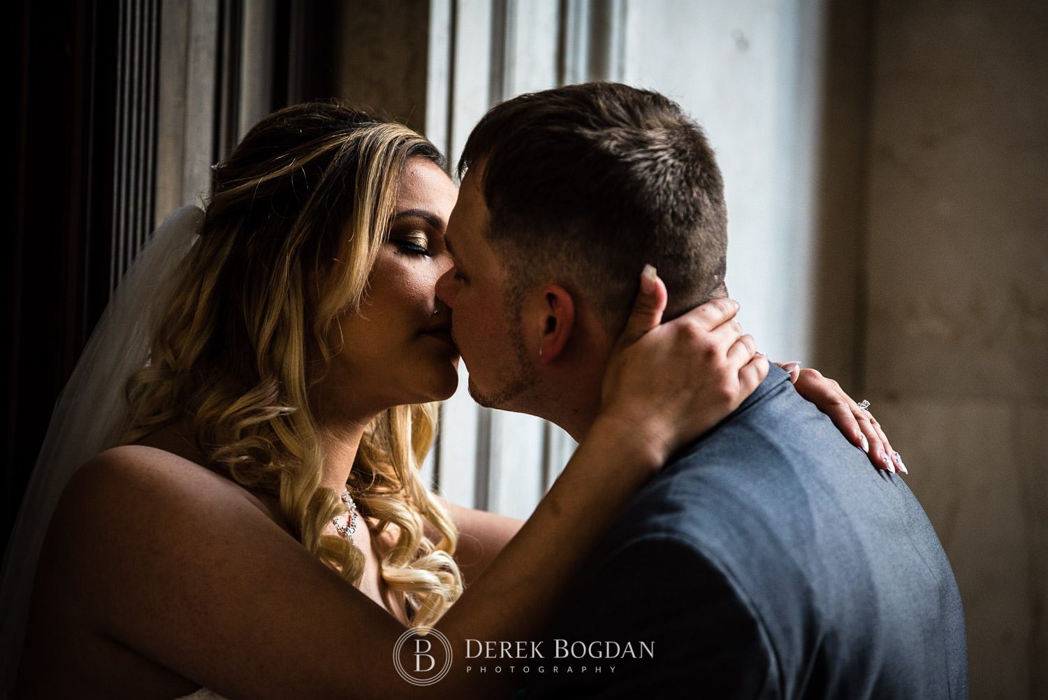 Bride and groom kiss Winnipeg wedding photographer