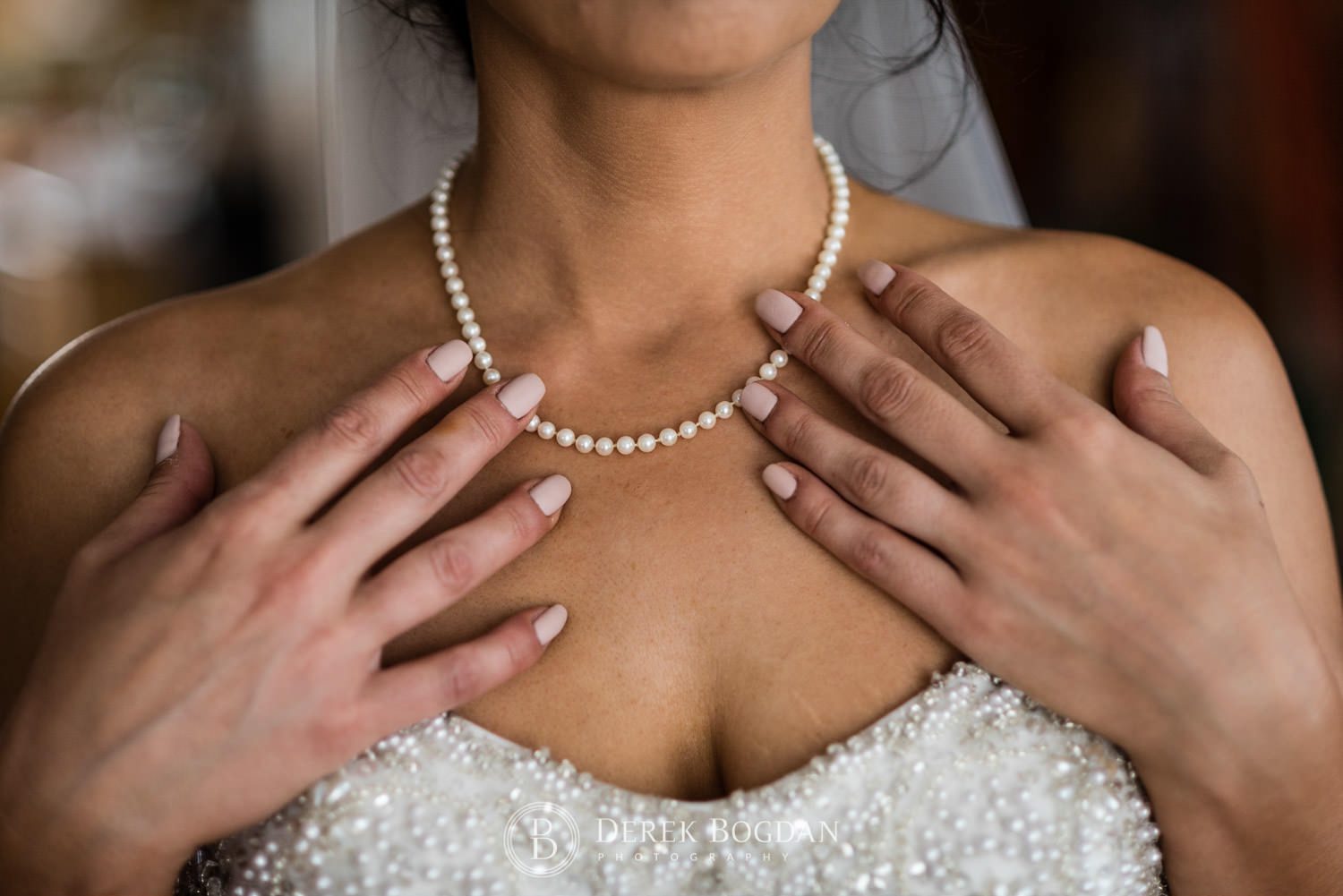 Bel Acres Golf wedding Manitoba bride getting ready details of neckline pearls jewellery