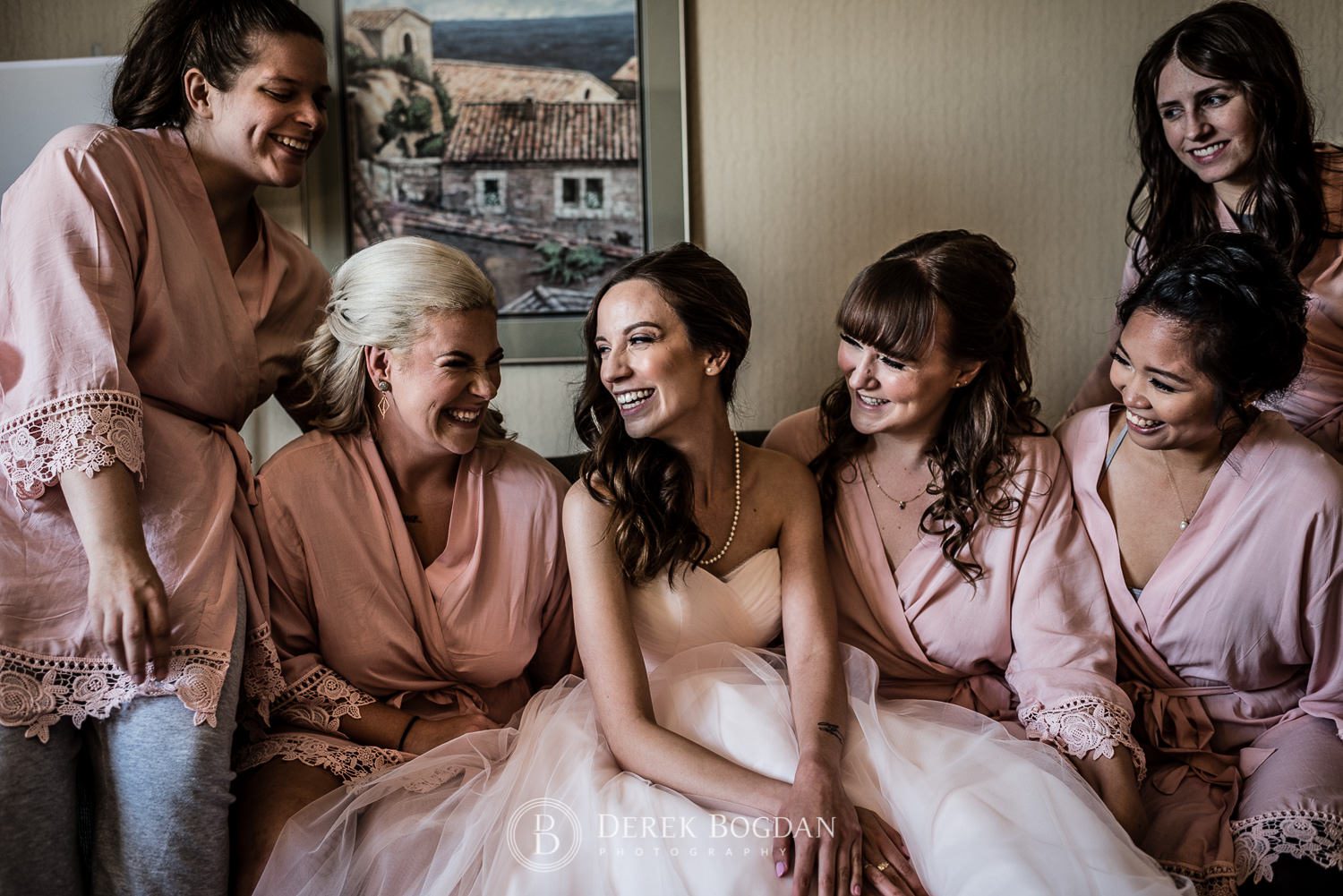 Bride and her girls all smiles getting ready at hotel