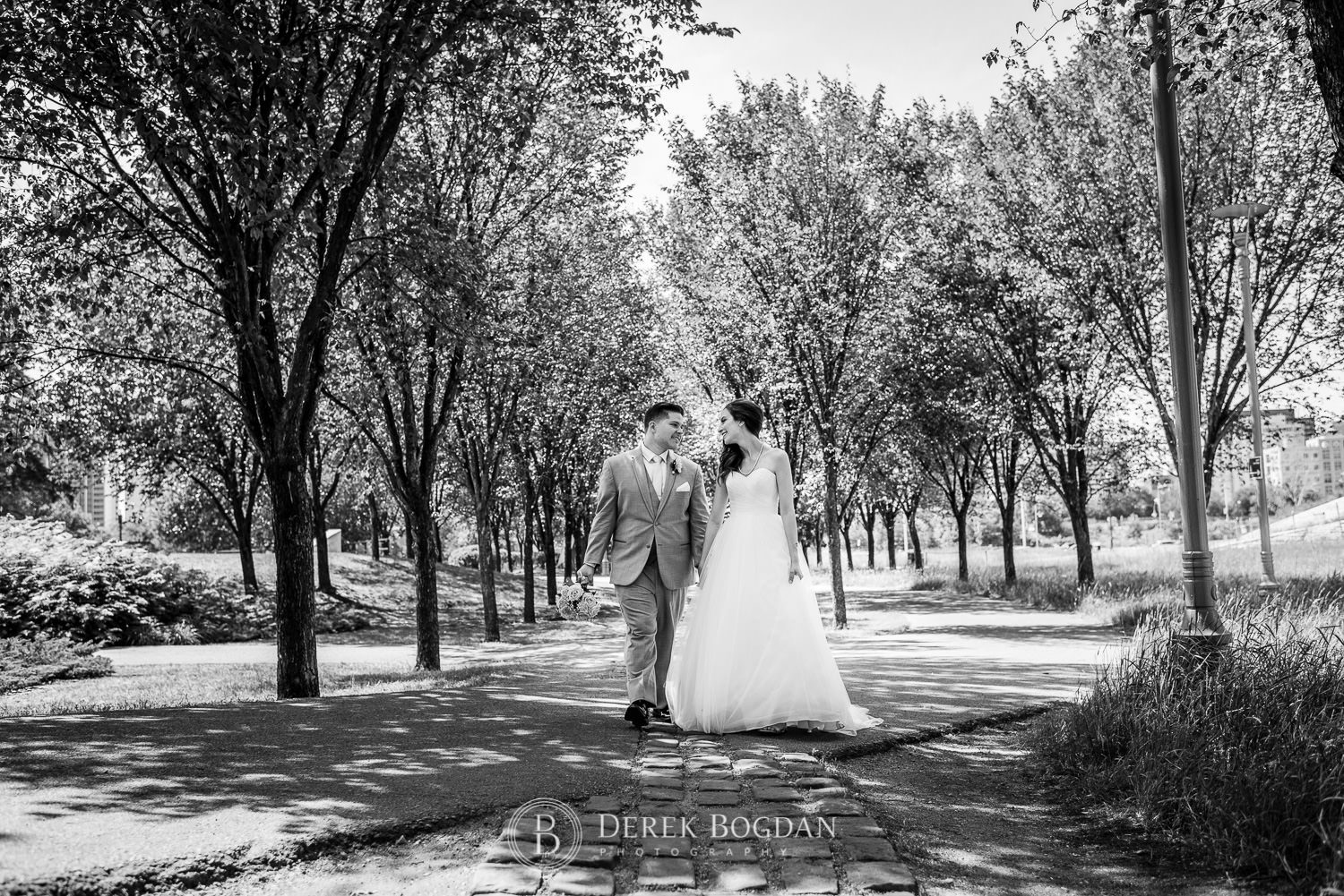 Bride and groom walking The Forks Winnipeg