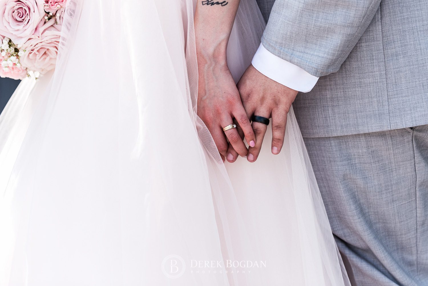 bride and groom holding hands wedding close up portrait