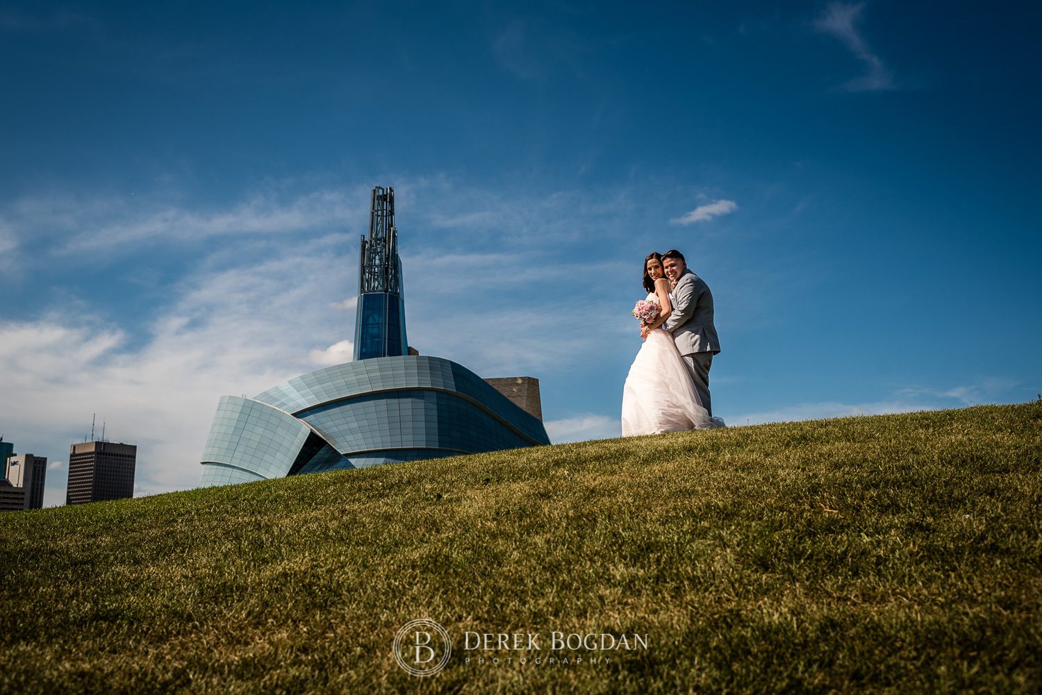 Bride and groom outdoor wedding portrait The forks Winnipeg Human Rights museum