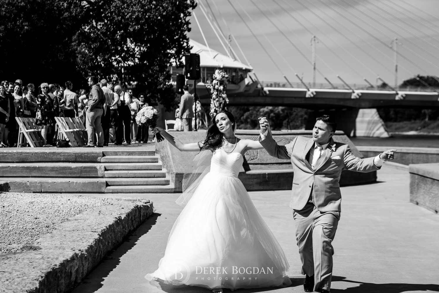 Outdoor wedding at the Forks National Historic Site bride and groom funny ceremony recessional photo