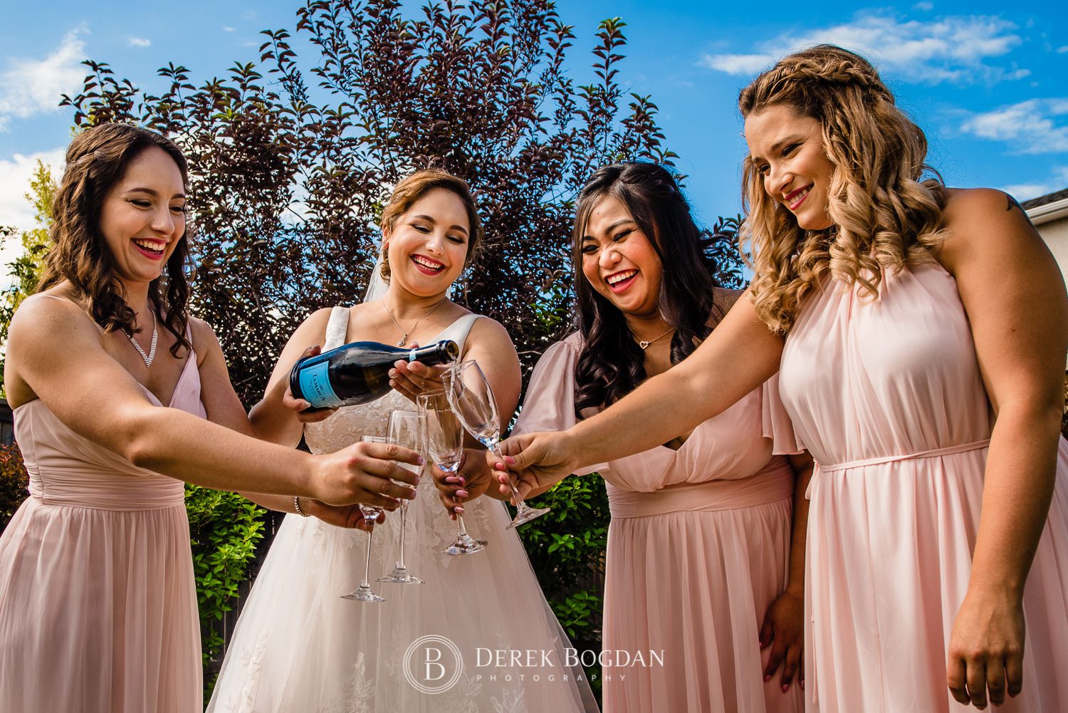Bride and bridesmaids champagne
