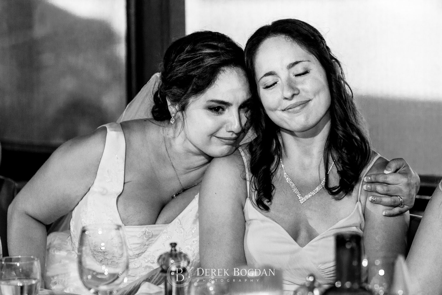 bride and sister hugging wedding reception speeches Ukrainian church wedding