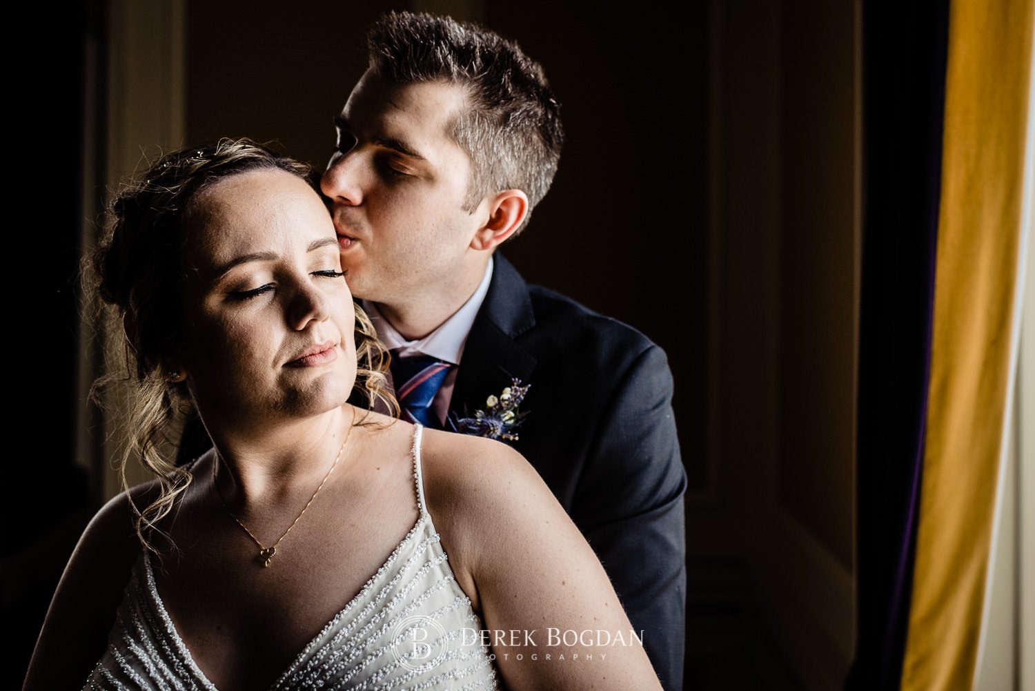 Manitoba Club Wedding post ceremony portrait photos groom kisses bride