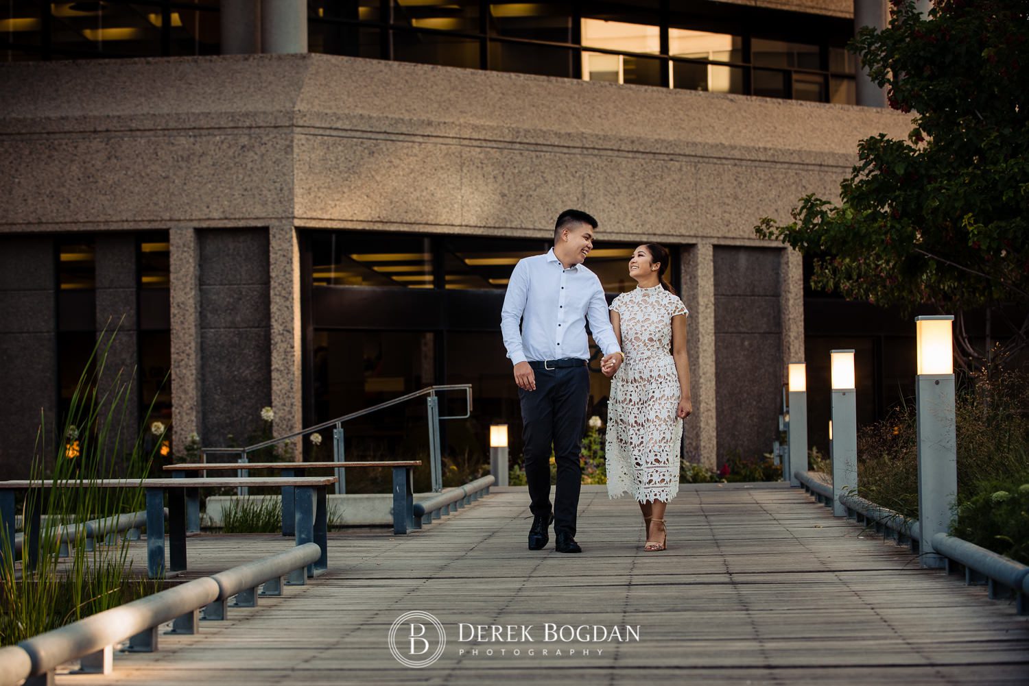 Engagement photo at Millenium Library Park couple walking and smiling