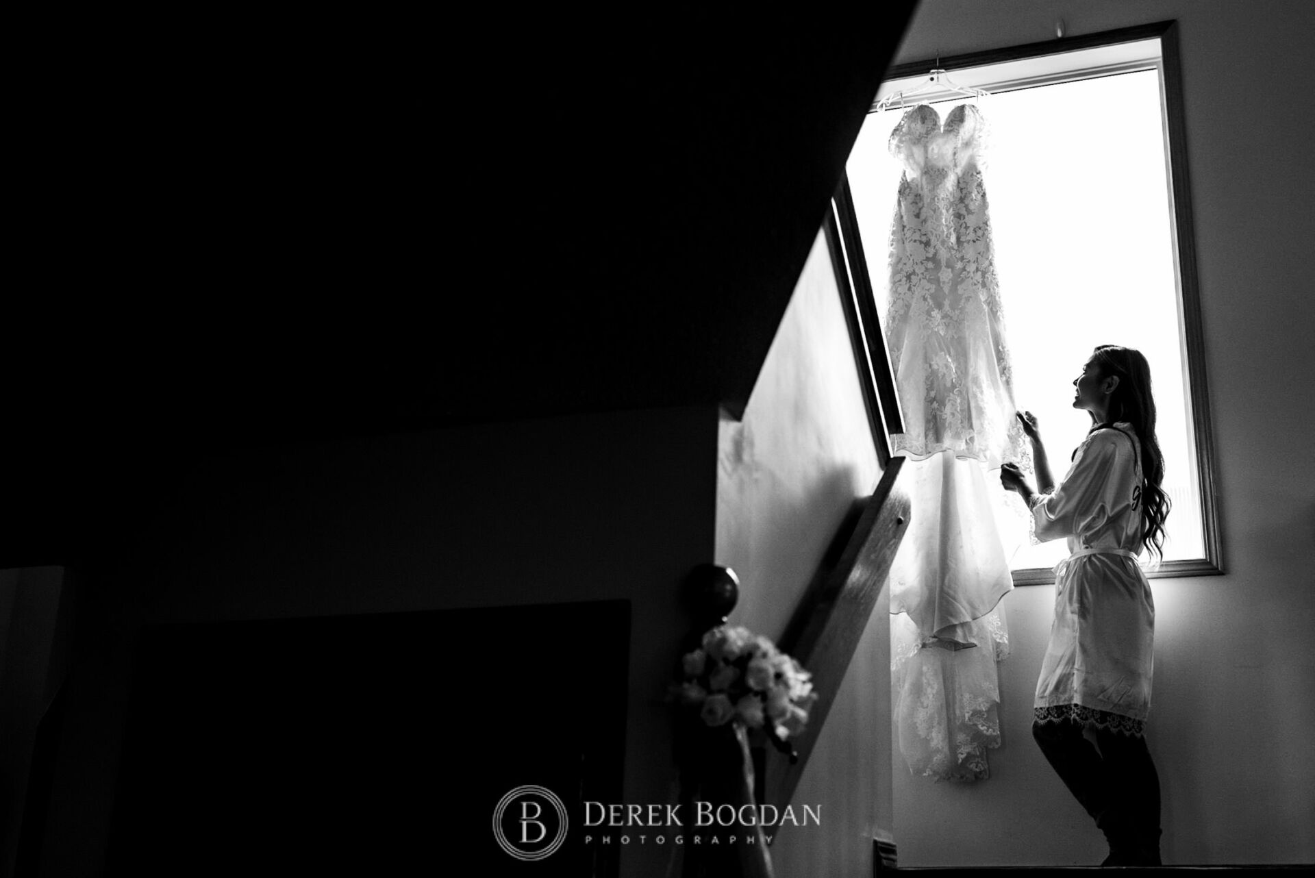 Winnipeg catholic wedding bride looking at her dress, getting ready