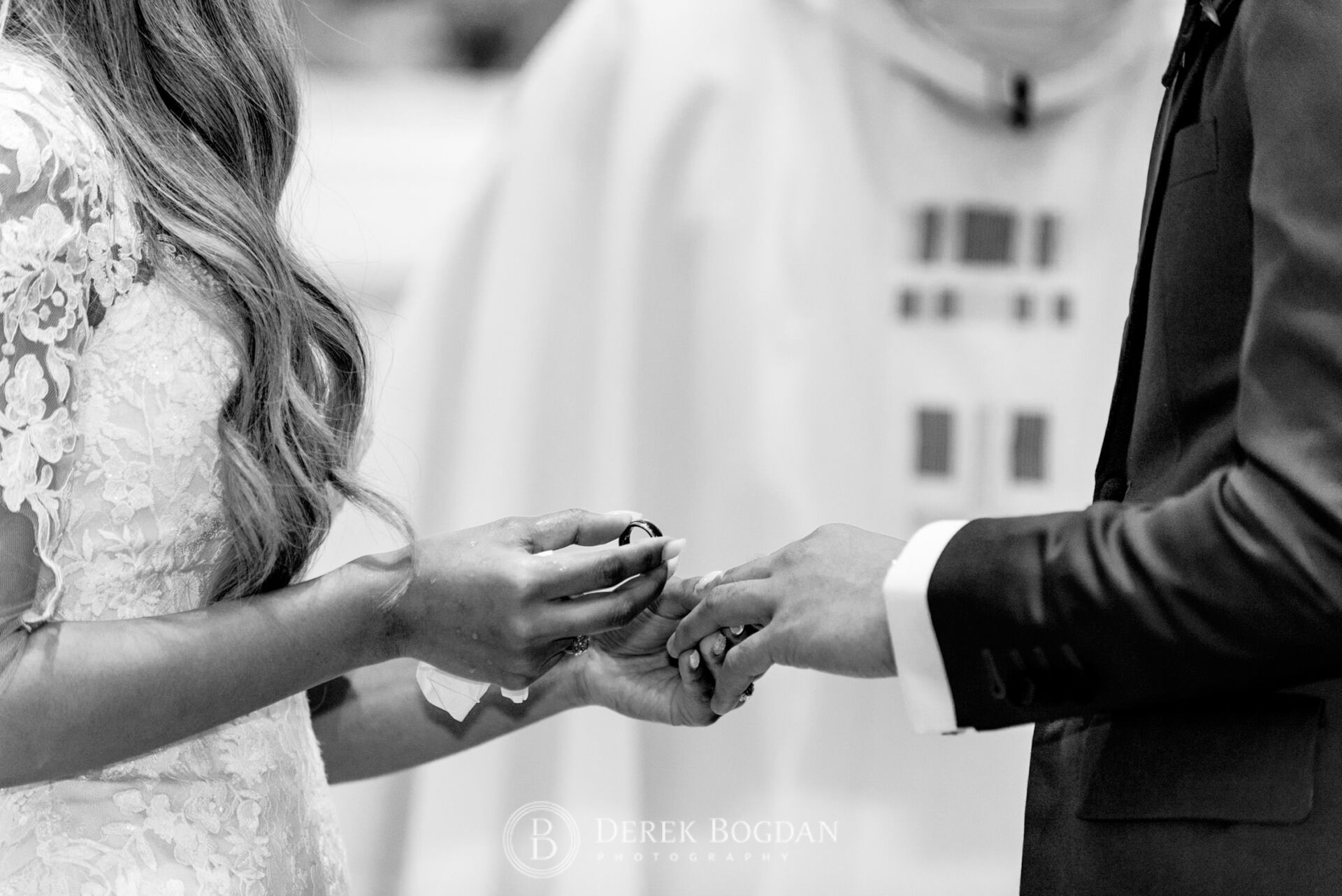 Winnipeg catholic wedding church ceremony, exchange of rings close up, St. Edward the Confessor Church