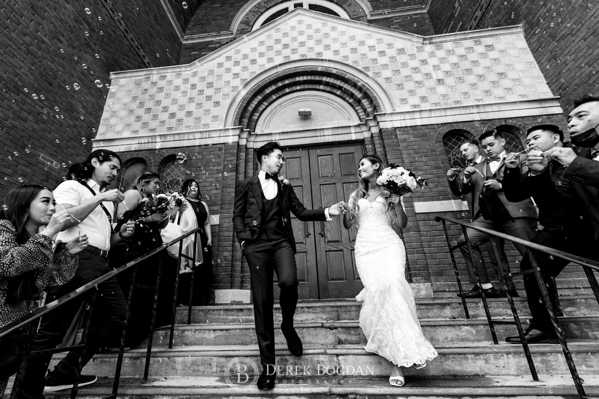 Winnipeg catholic wedding St. Edward the Confessor Church bride groom front steps