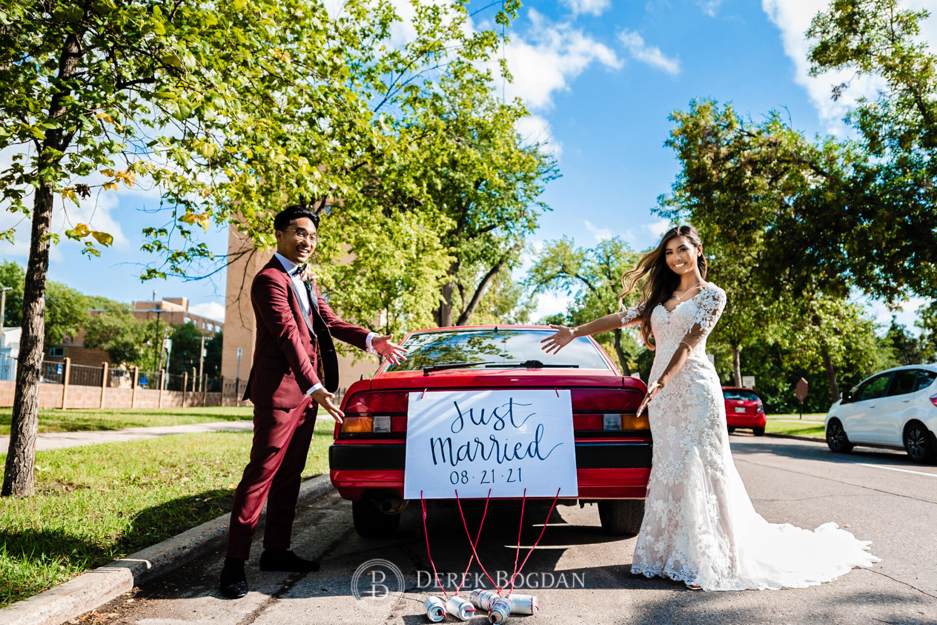 Winnipeg catholic wedding newlyweds just married sign on their car